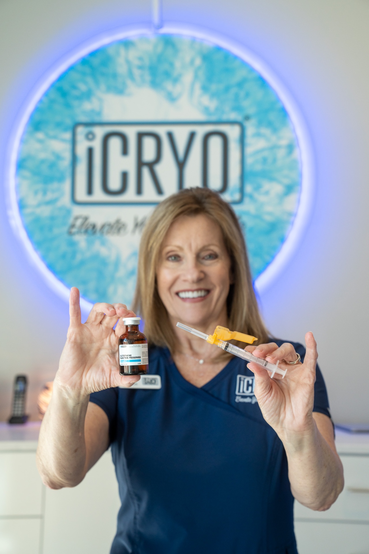 iCRYO Clifton Park RN holding an IM vitamin shot vial and syringe