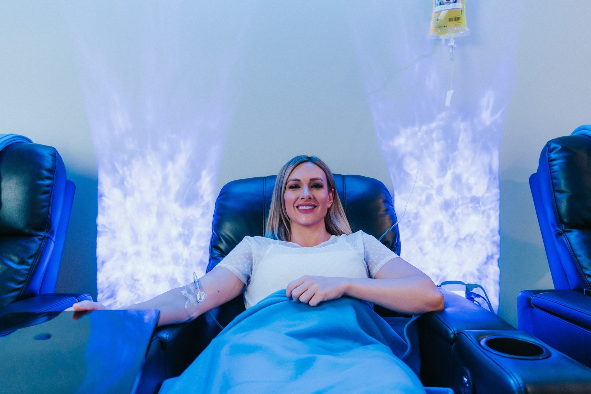 Guest relaxing during an IV drip at iCRYO Clifton Park